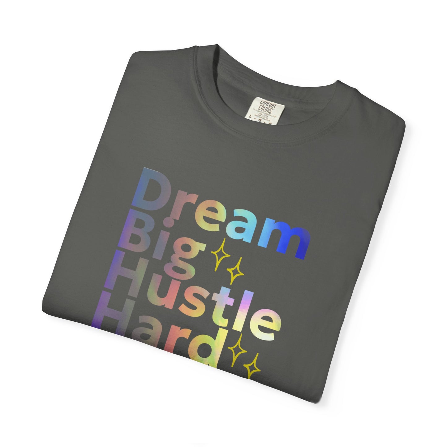 Folded dark gray t-shirt with colorful 'Dream Big Hustle Hard' text on a white background