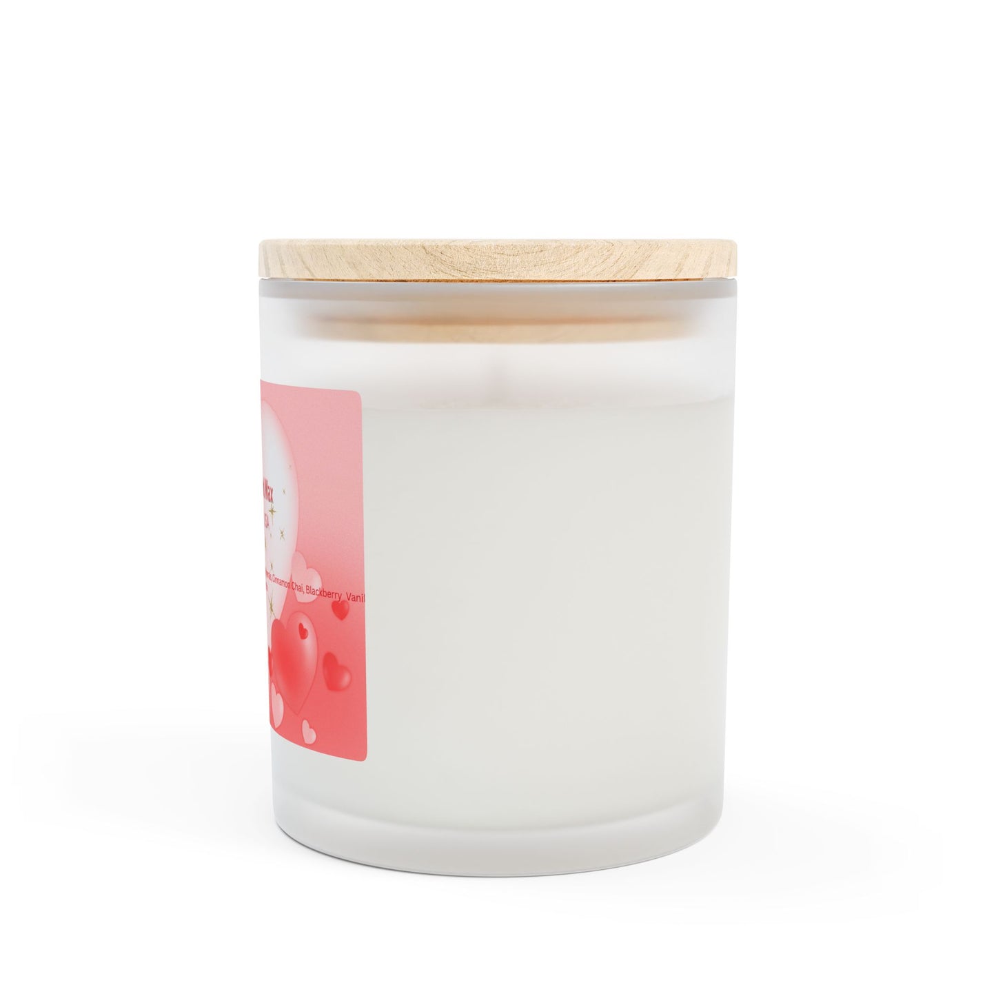 A frosted glass candle with a wooden wick and a label that includes hearts and text indicating it is made with coconut soy blended wax, hand-poured in the USA.