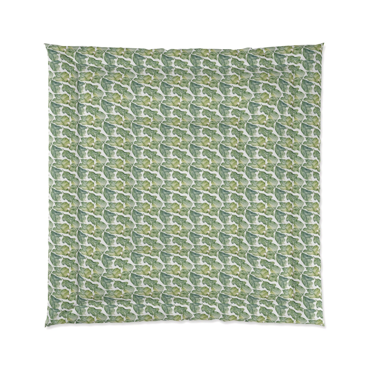 A comforter with a geometric pattern in shades of green and white, displayed against a white background.