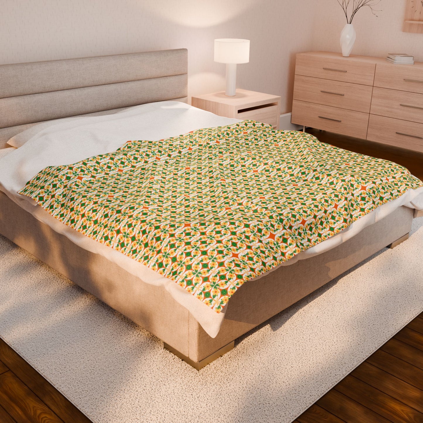 Bed with a patterned blanket in a bedroom setting