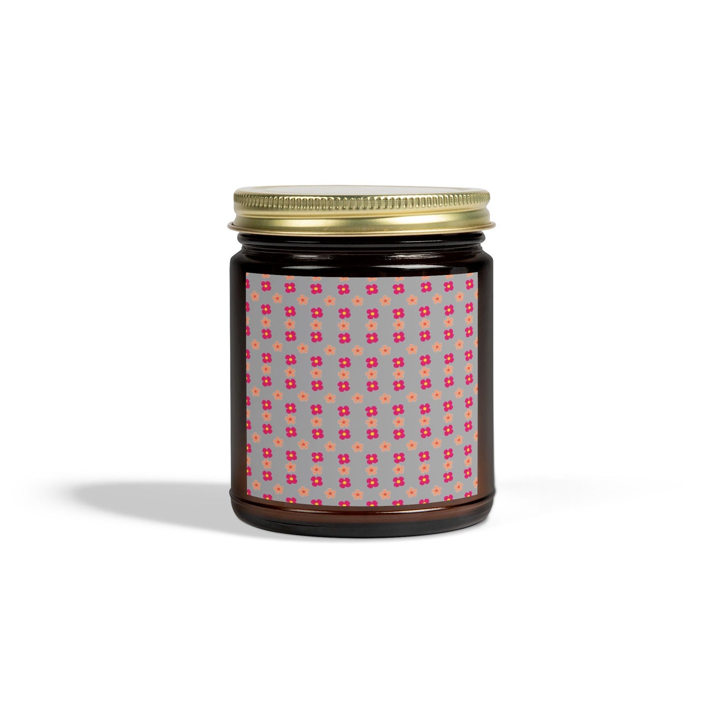 Black jar with gold lid and patterned label on a white background