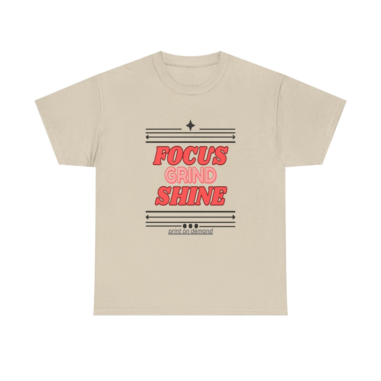 A sand unisex heavy cotton tee with the text 'FOCUS GRIND SHINE' printed on the front.