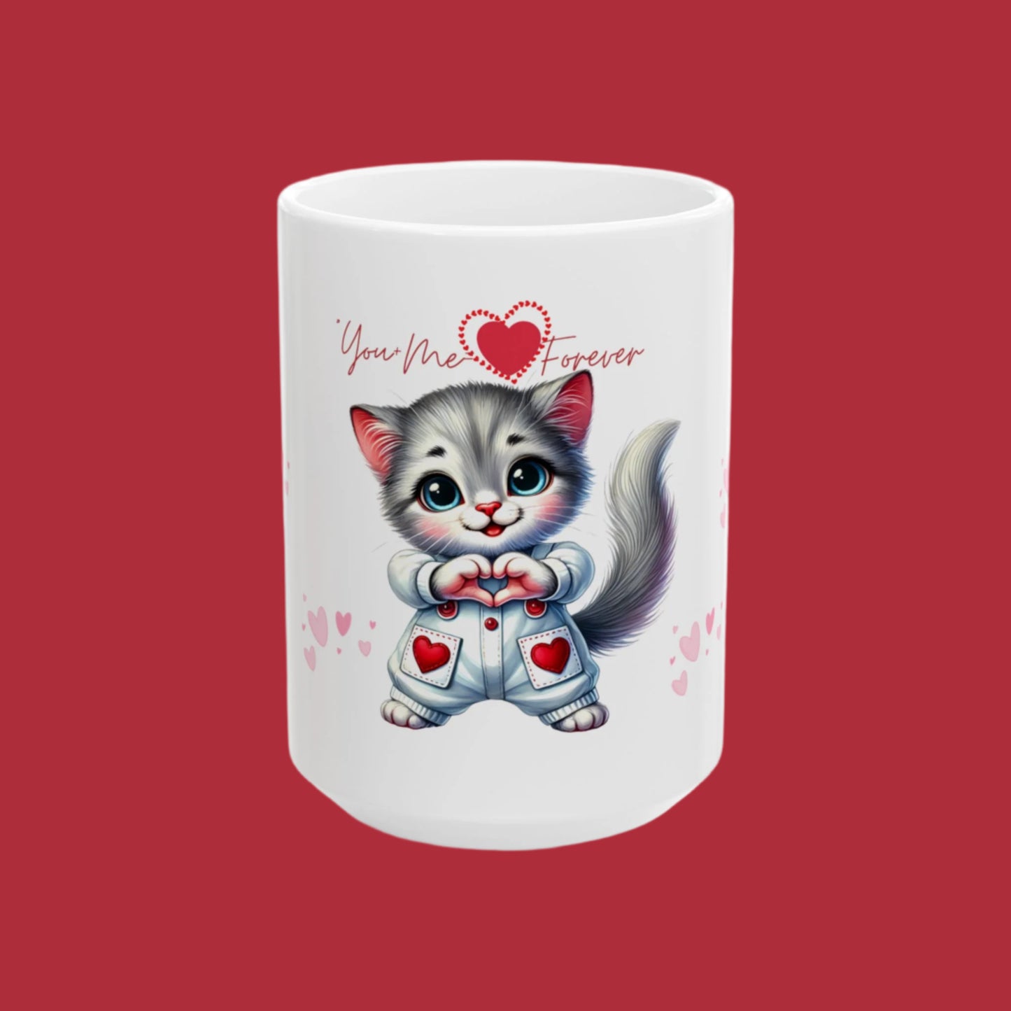 A white ceramic mug with a cartoon image of a gray cat holding a red heart, and the text 'You Meow Forever' is printed on it.