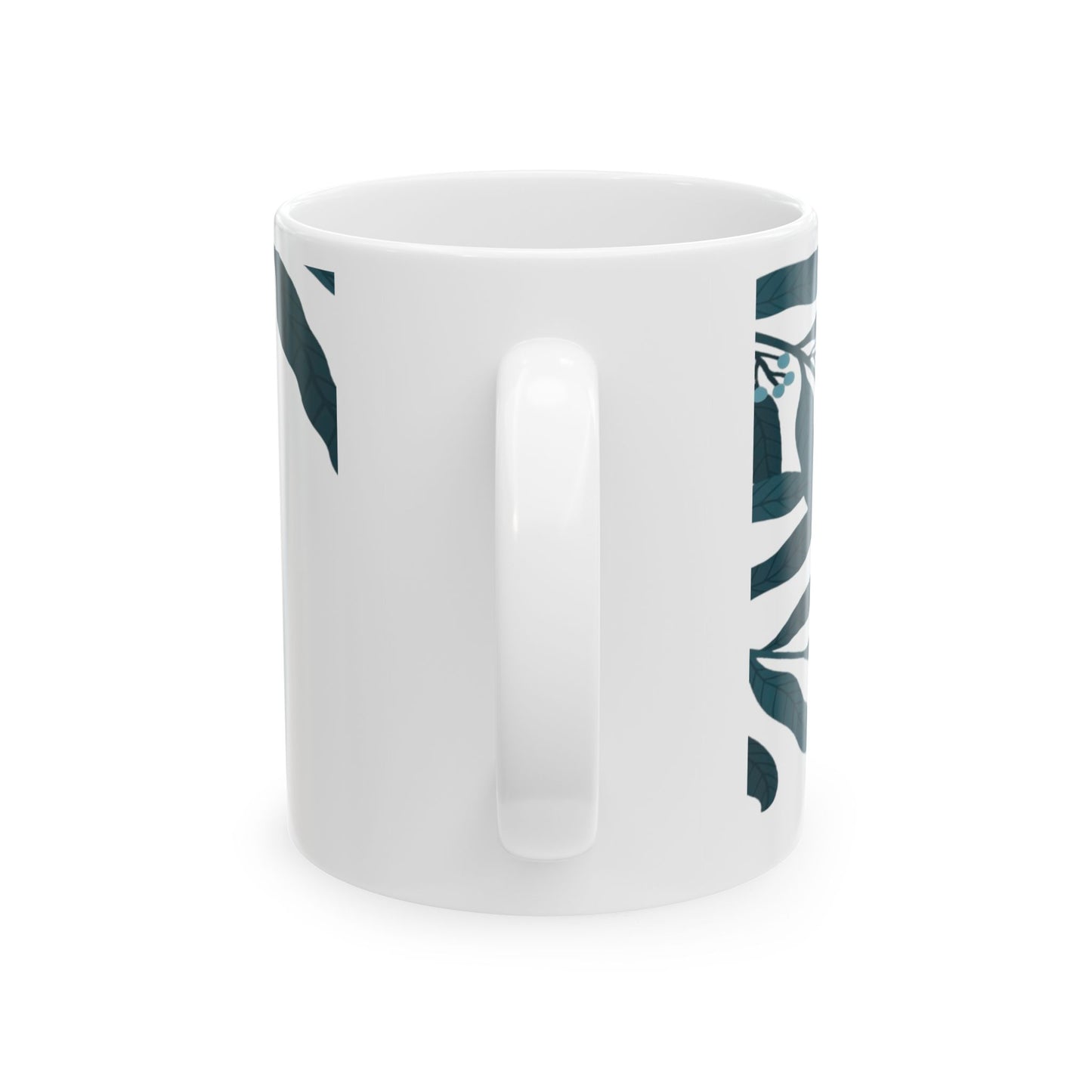 White mug with green leaf pattern on a white background