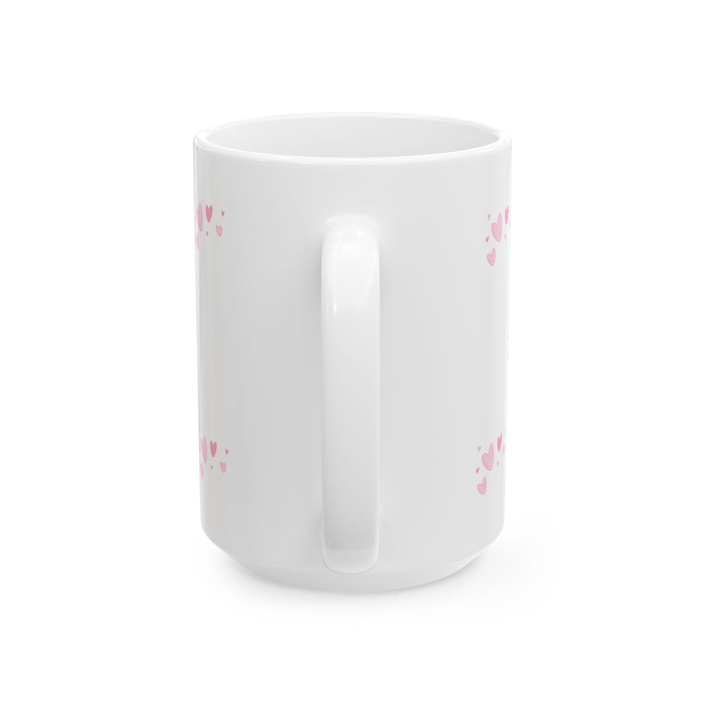 White mug with pink heart patterns on a white background