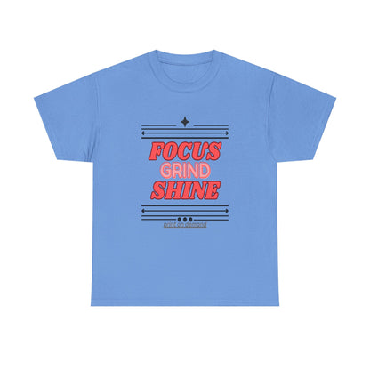 A carolina blue unisex heavy cotton tee with the text 'FOCUS GRIND SHINE' printed on the front.