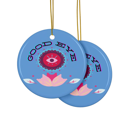 Two blue ornaments with 'Good Eye' design on a white background
