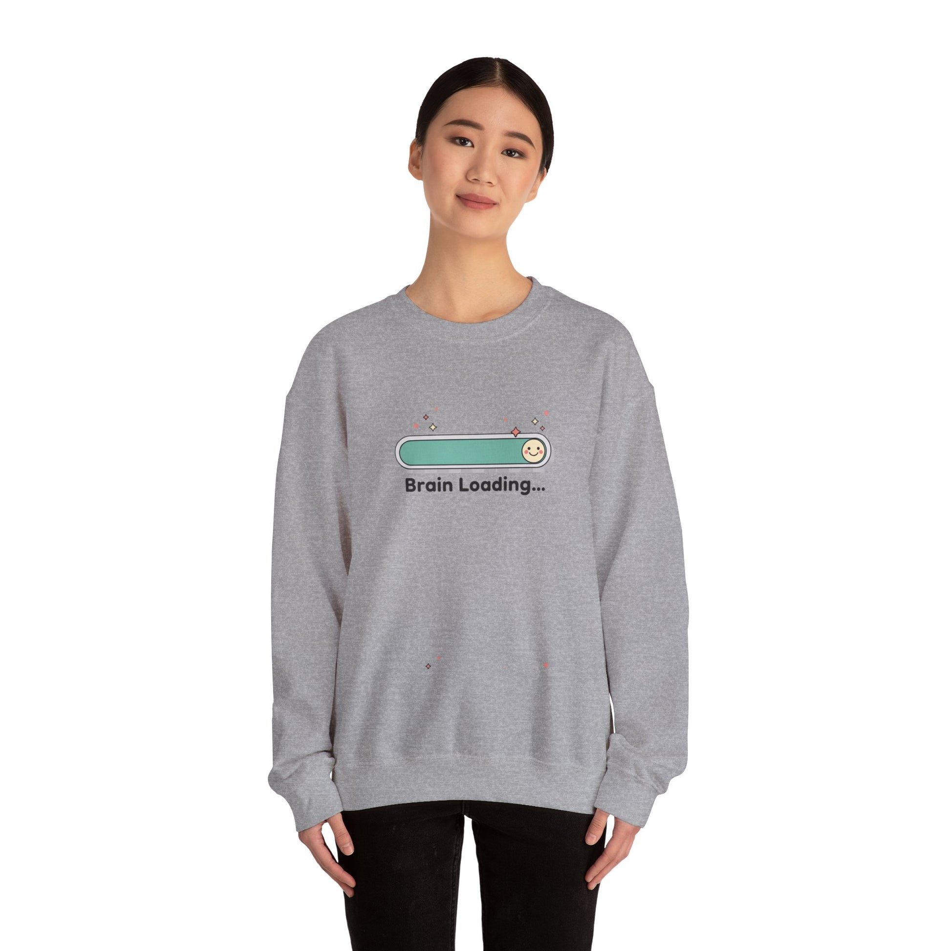 Person wearing a gray sweatshirt with a graphic design on a white background