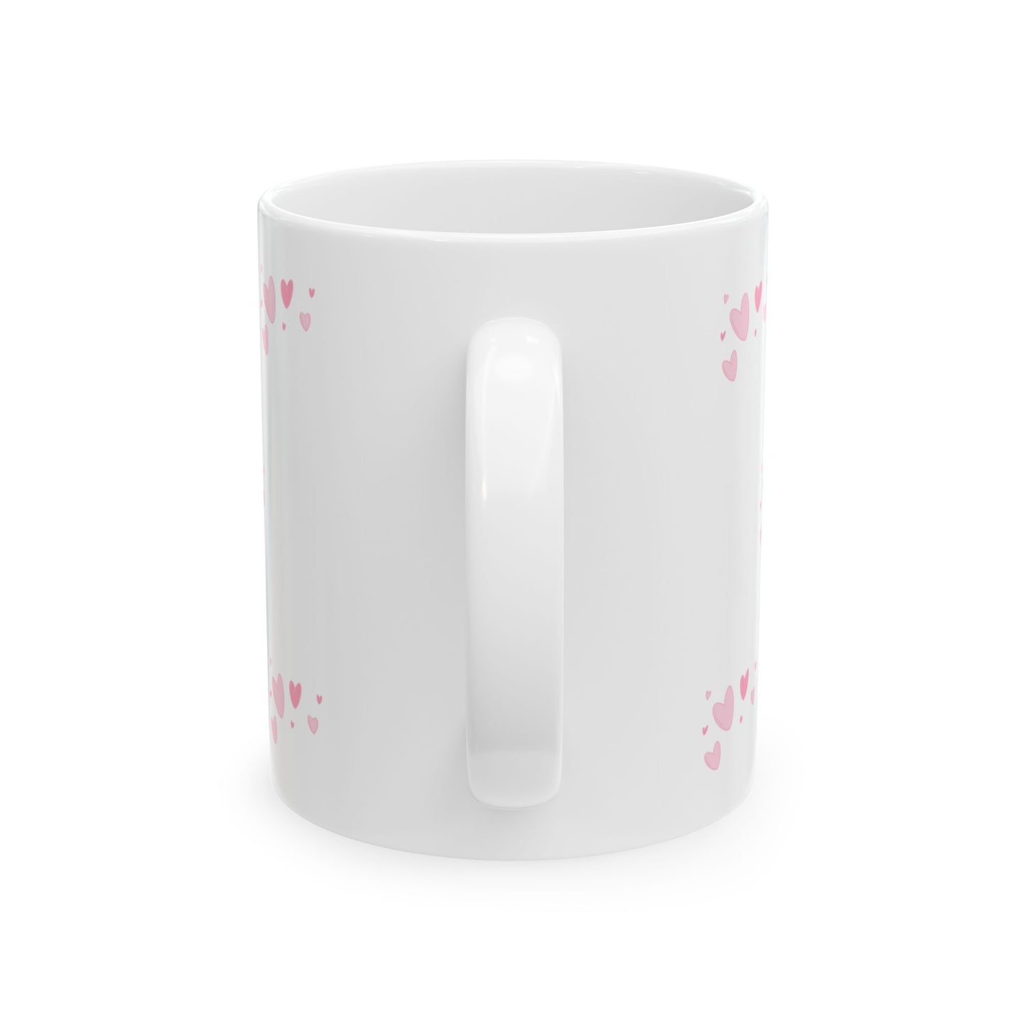 White mug with pink heart patterns on a white background