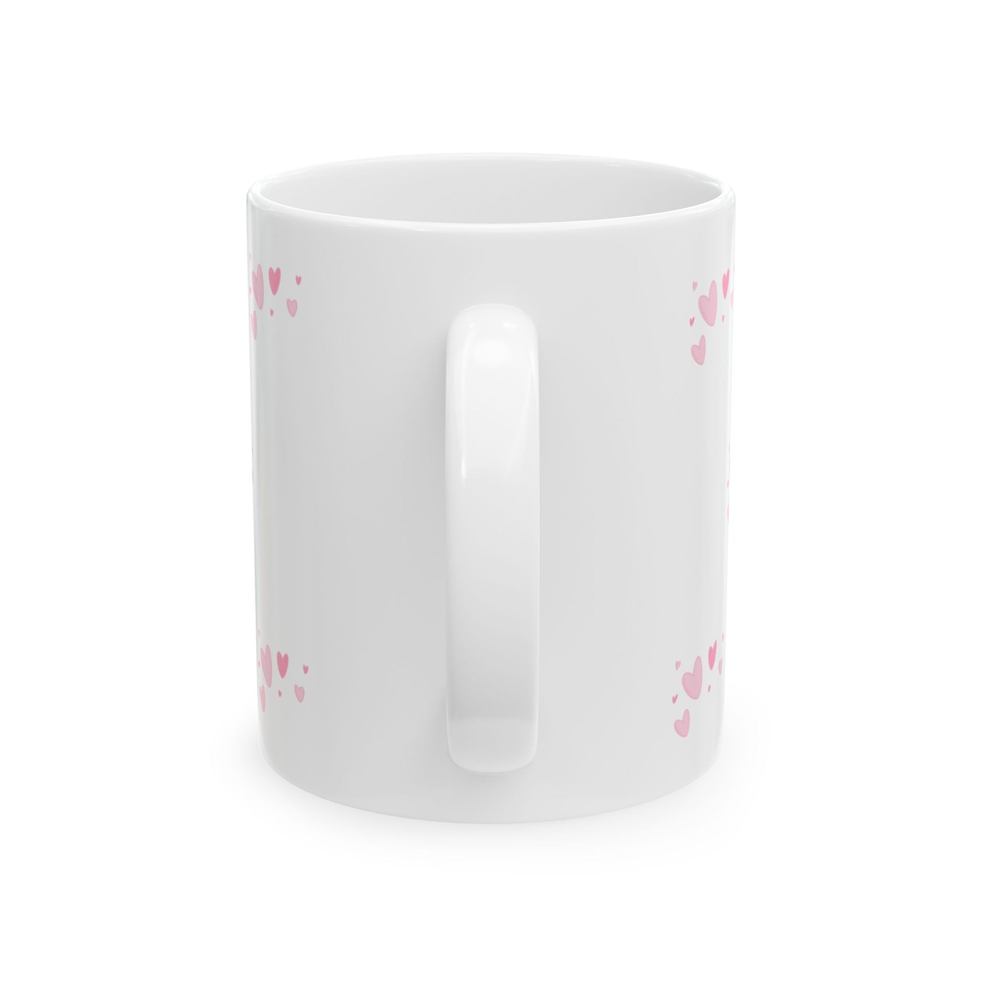 White mug with pink heart patterns on a white background