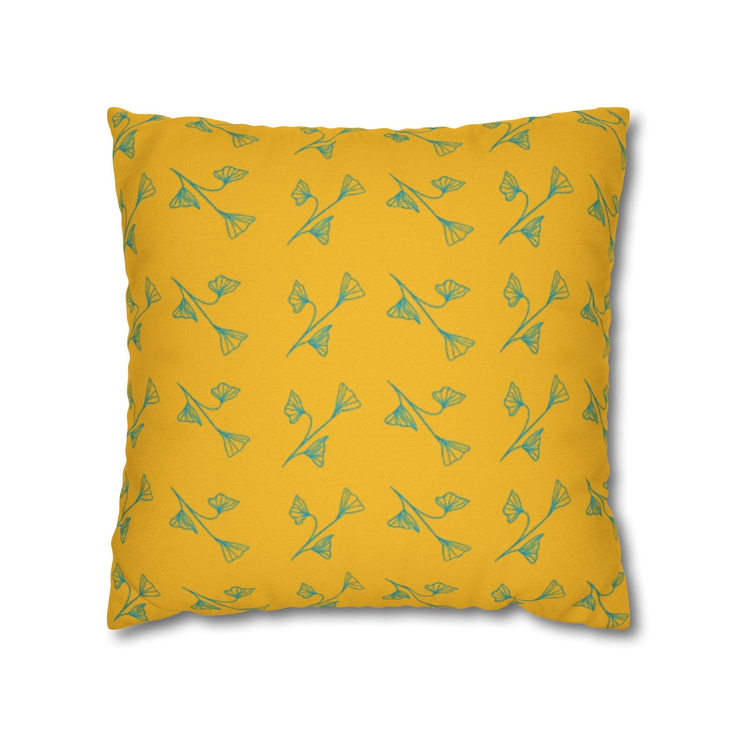 A square-shaped yellow pillowcase with a green leaf pattern.