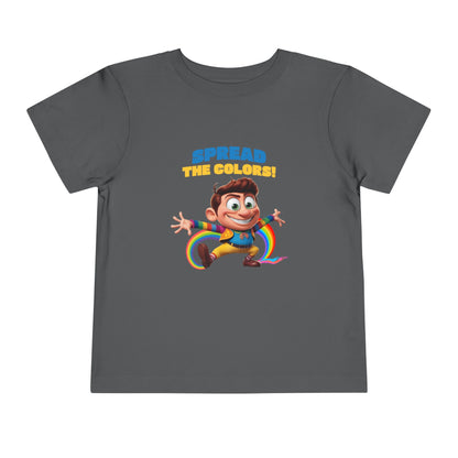 Cartoon boy jumping with rainbow trail and "Spread the Colors!" text on dark heather grey T-shirt.

