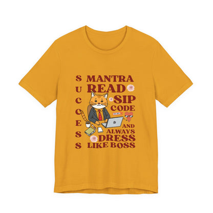 Yellow t-shirt with a graphic of a cat and text on a white background