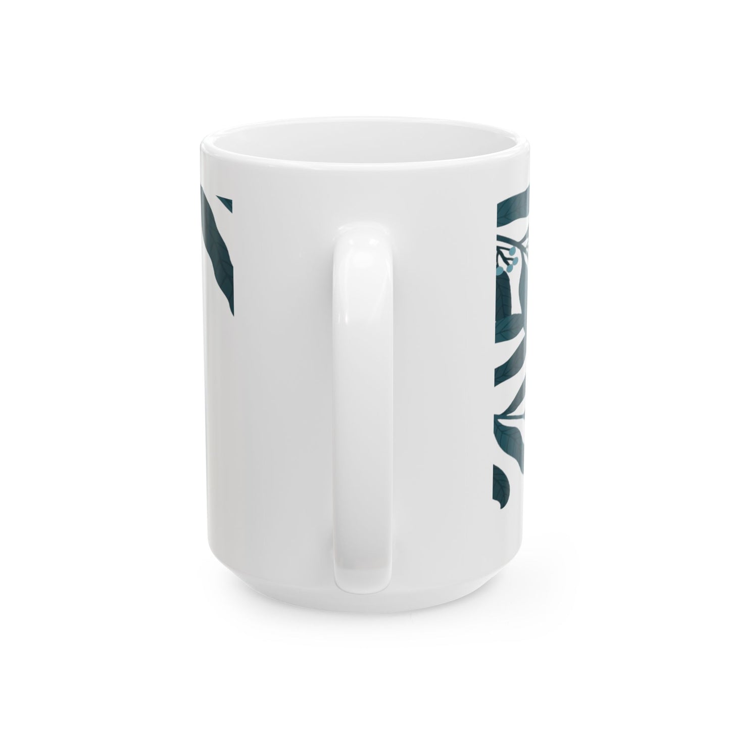 White mug with green leaf pattern and text on a white background