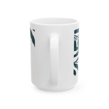 White mug with green leaf pattern and text on a white background