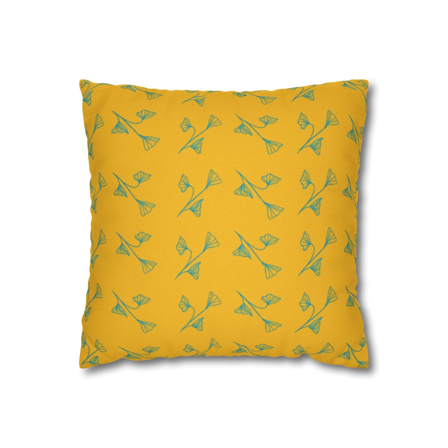Yellow pillow with green floral pattern on a white background