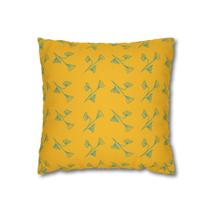 Yellow pillow with green floral pattern on a white background