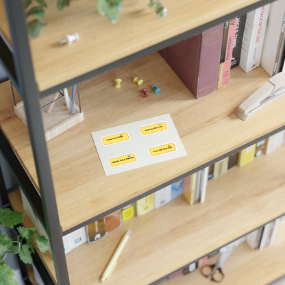 Wooden shelf with books, stationery, and a sheet of post-it notes.