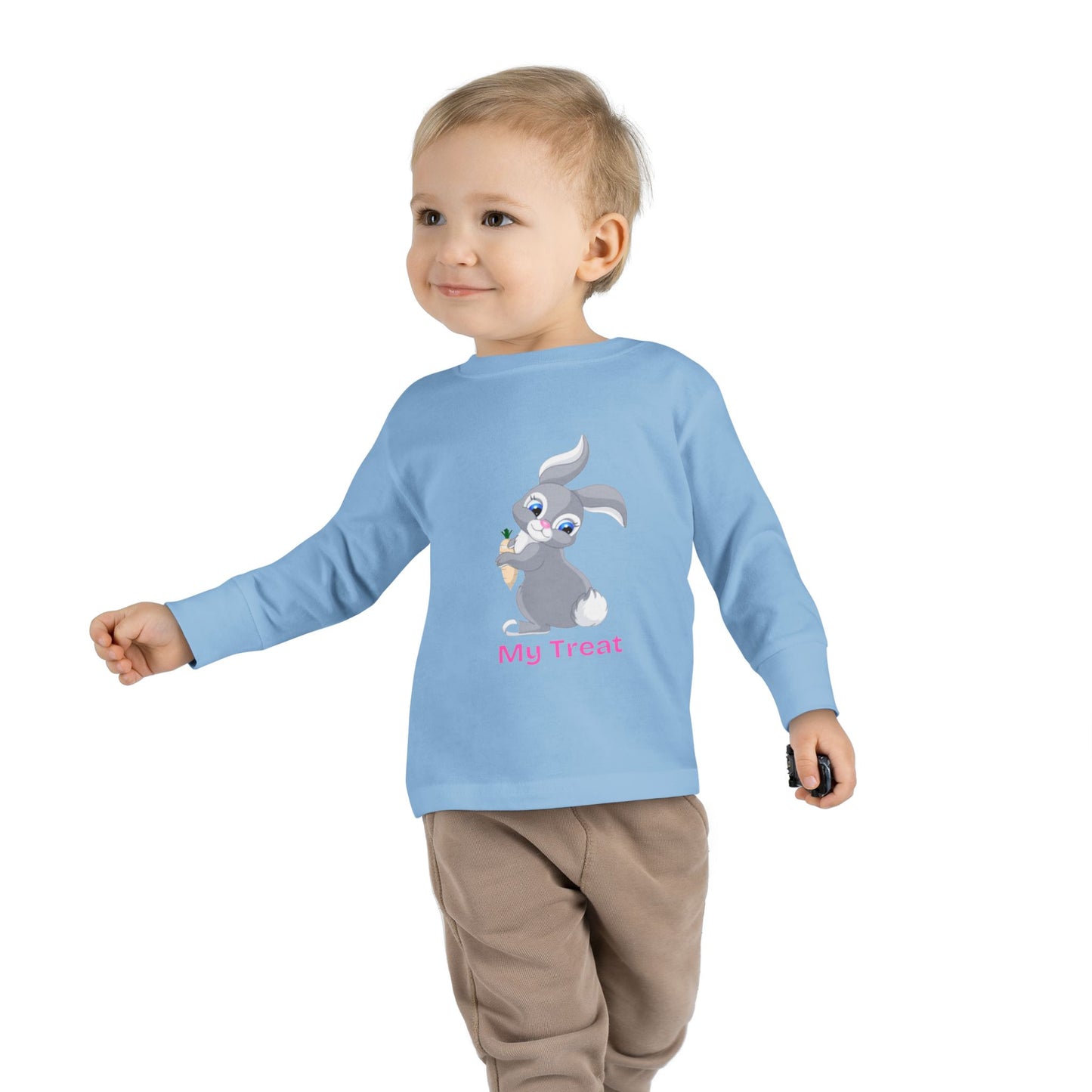 Child wearing a blue long-sleeve shirt with a cartoon character on a white background