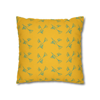 Yellow pillow with green floral pattern on a white background