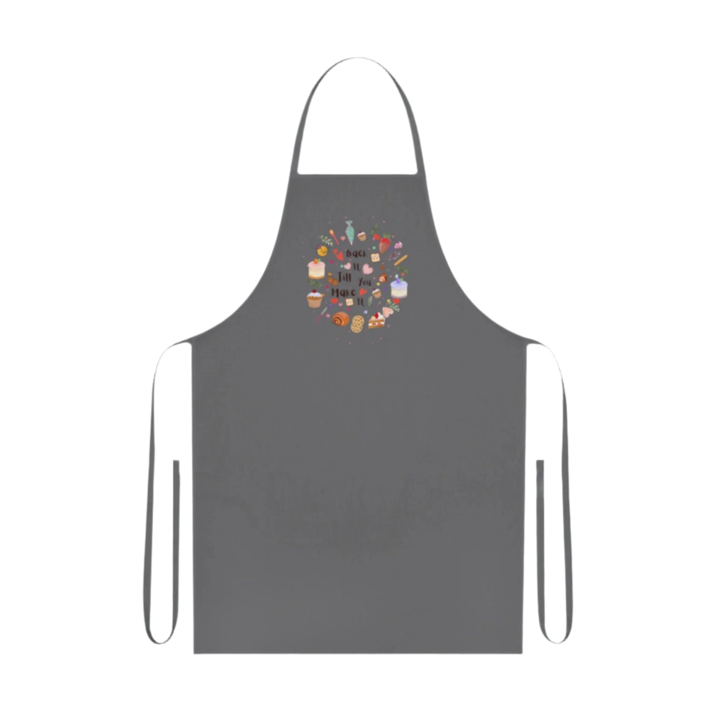 Cotton kitchen apron with "Bake it till you make it" text and circular illustrations of cake, biscuit, cone, and baking utensils.

