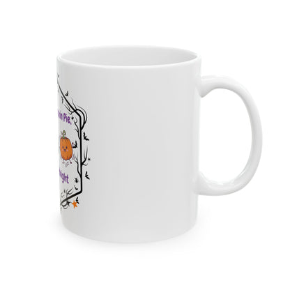 A white ceramic mug with a Halloween-themed graphic on the side, featuring a small orange pumpkin, bats, and purple text, shown against a plain white background.