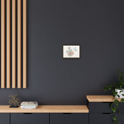 Framed artwork on a dark wall with wooden shelves and decor items.