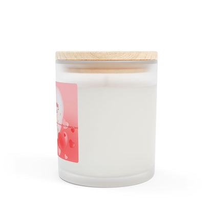 A frosted glass candle with a wooden wick and a label that includes hearts and text indicating it is made with coconut soy blended wax, hand-poured in the USA.
