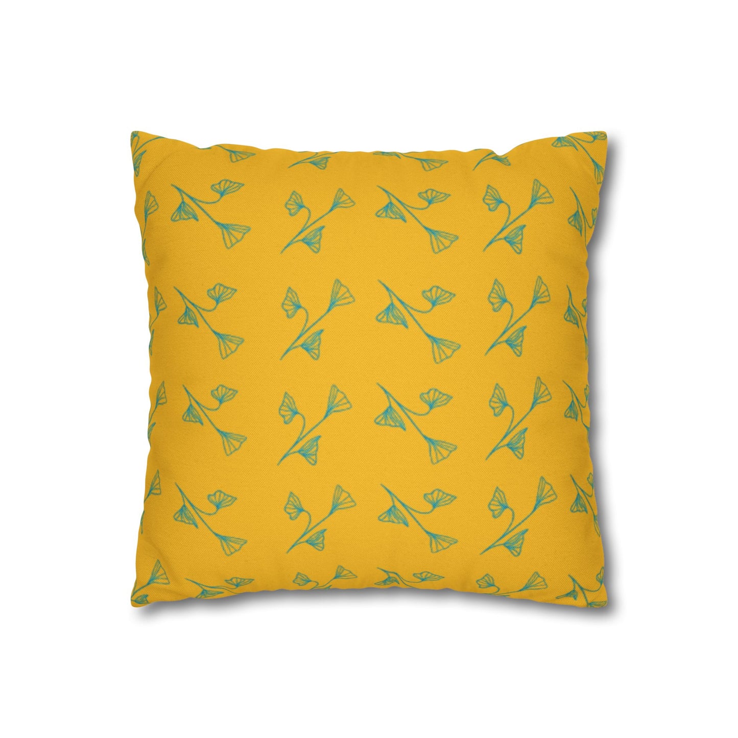Yellow pillow with green pattern on a white background