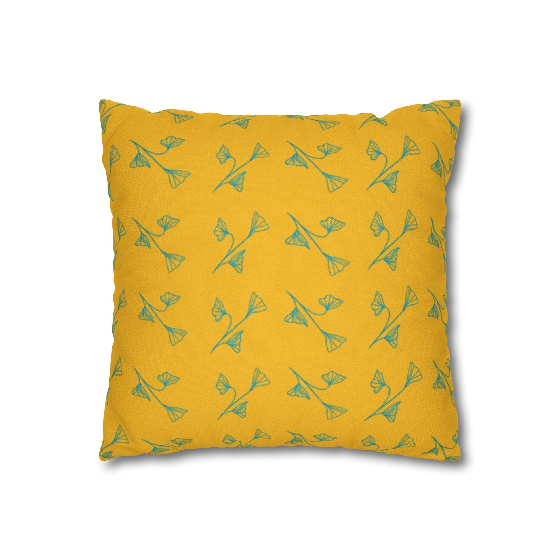 Yellow pillow with green pattern on a white background