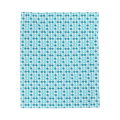 Soft velveteen blanket folded on bed in a cozy room