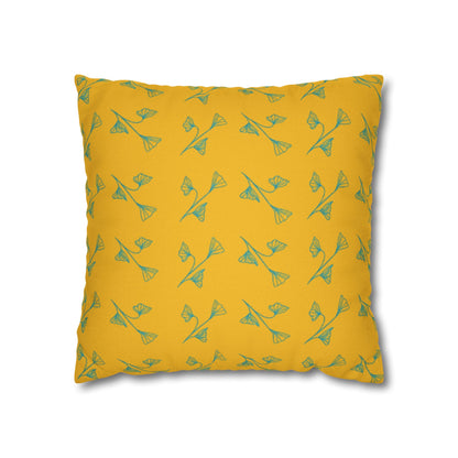A square-shaped yellow pillowcase with a green leaf pattern.