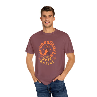 Man wearing a maroon t-shirt with a motivational quote on a white background