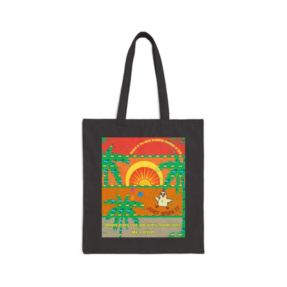 A cotton canvas tote bag with a printed design featuring a sunset, trees, and a character.