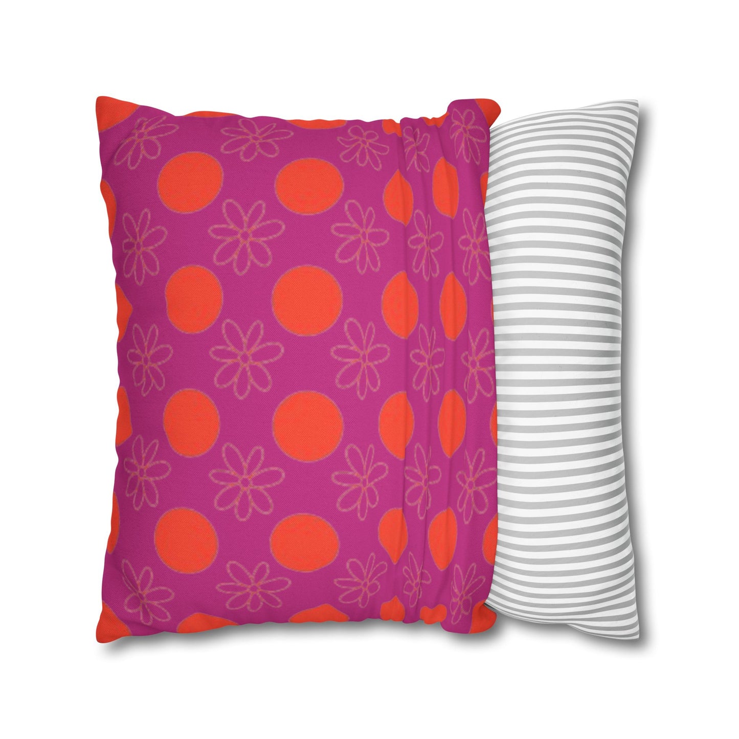  pillow with patterned covers, one pink with red circles and flowers, the other white with gray stripes, on a white background.