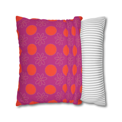  pillow with patterned covers, one pink with red circles and flowers, the other white with gray stripes, on a white background.