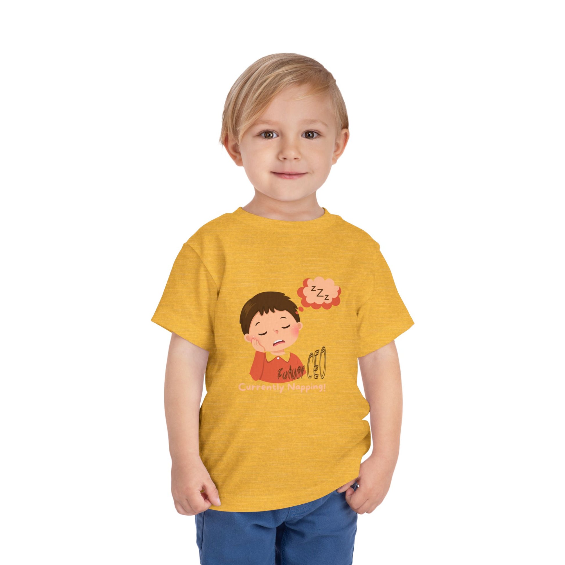 Child wearing a yellow t-shirt with a cartoon design on a white background