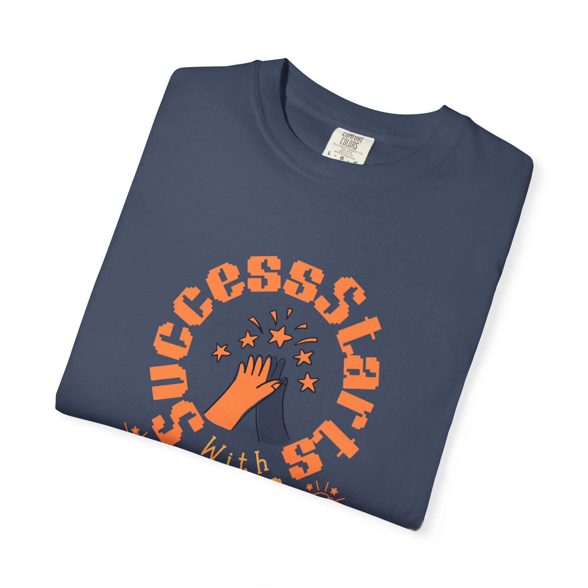 Folded navy blue t-shirt with orange graphic and text on a white background