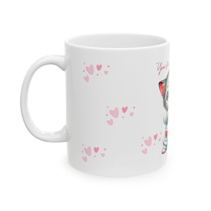 White mug with pink heart patterns on a white background