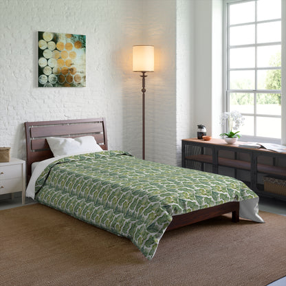Bedroom with a green patterned comforter on a bed.