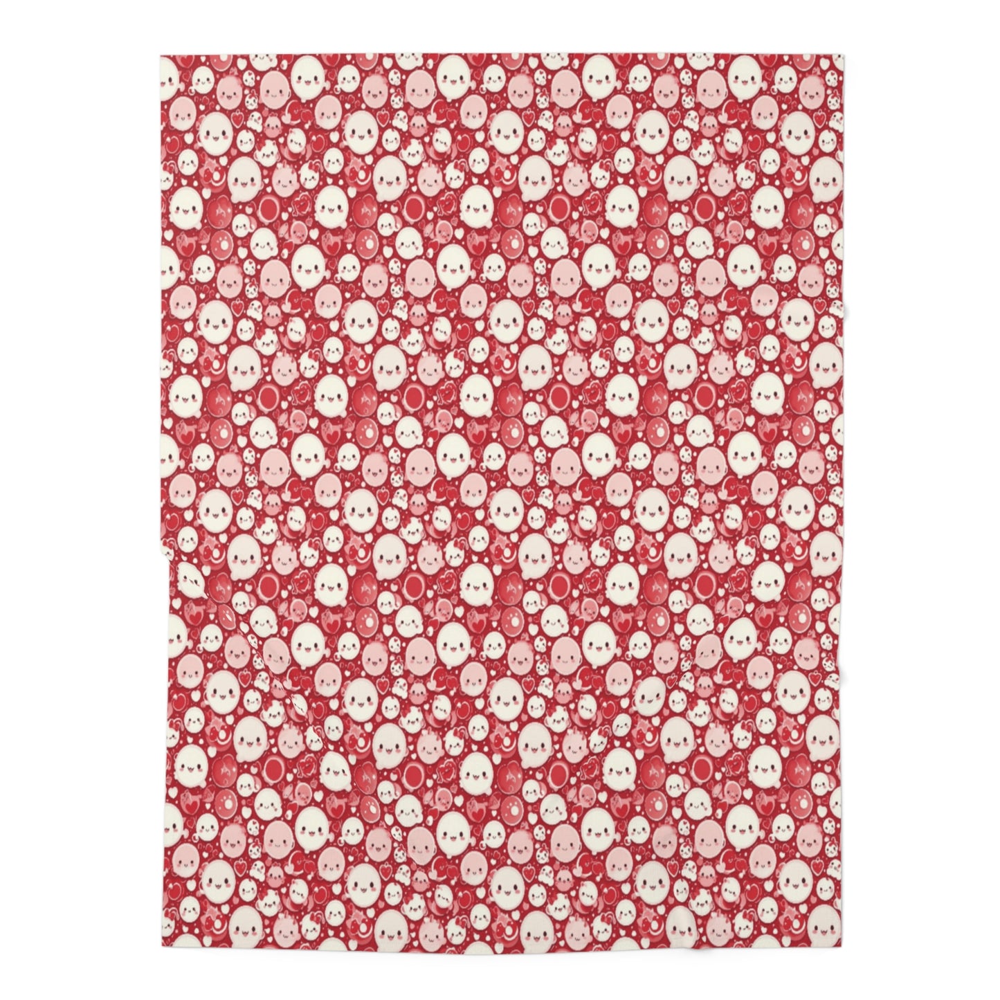 A red and white baby swaddle blanket with a pattern of cute faces.