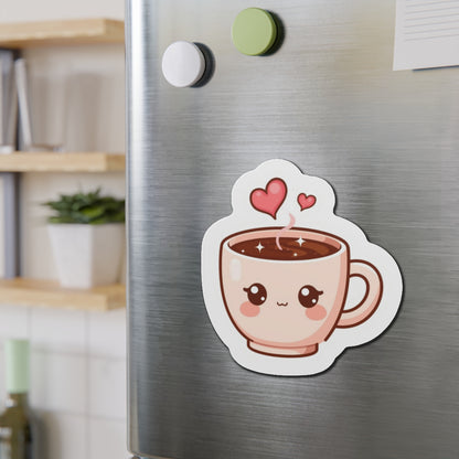 Fridge magnet shaped like a cartoon coffee cup with hearts on a metallic surface.