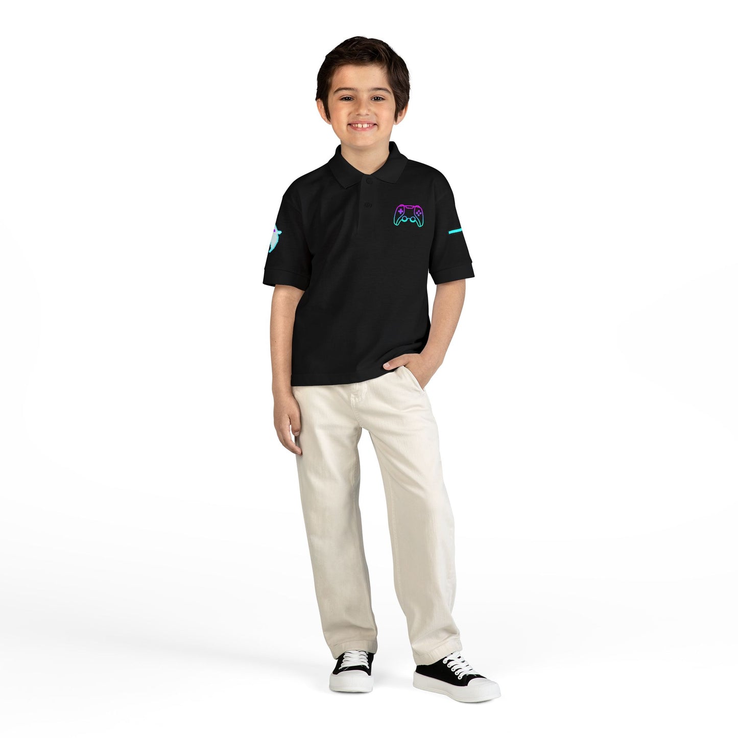 Child wearing a black polo shirt with a logo and white pants on a white background