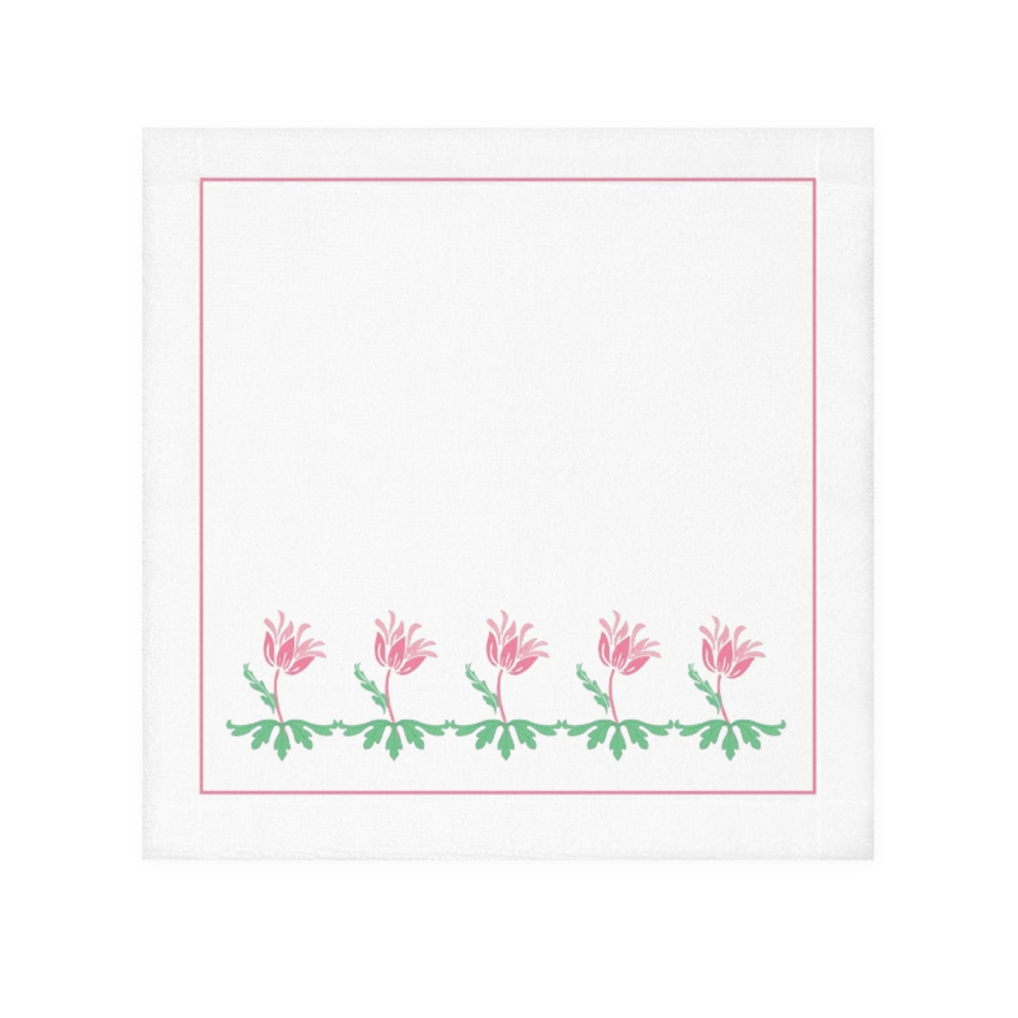 A white face towel with a printed floral design along the lower edge, in pink and green colors.