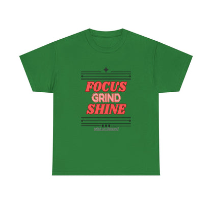 A turf green unisex heavy cotton tee with the text 'FOCUS GRIND SHINE' printed on the front.