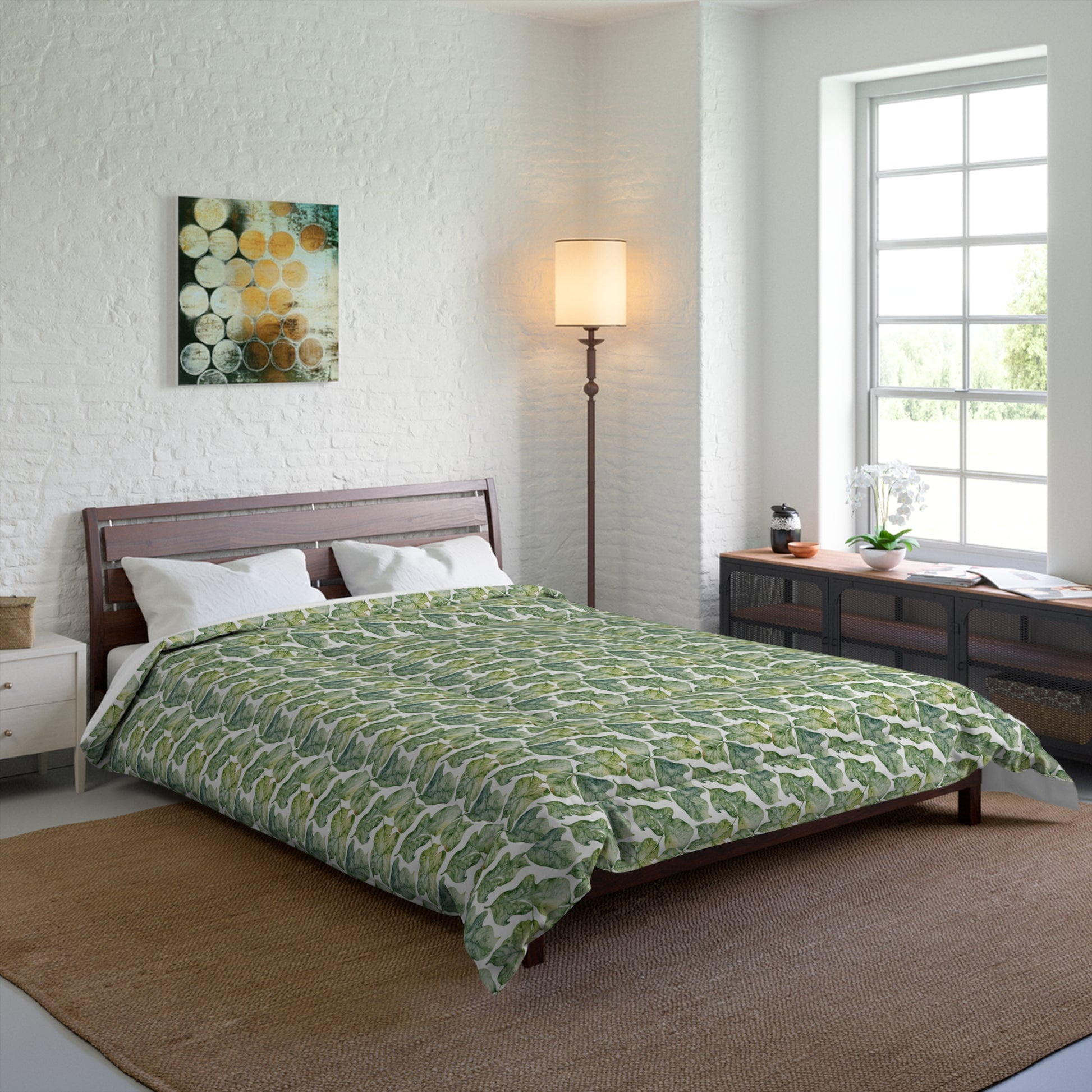 Bedroom with a green patterned comforter on a bed.