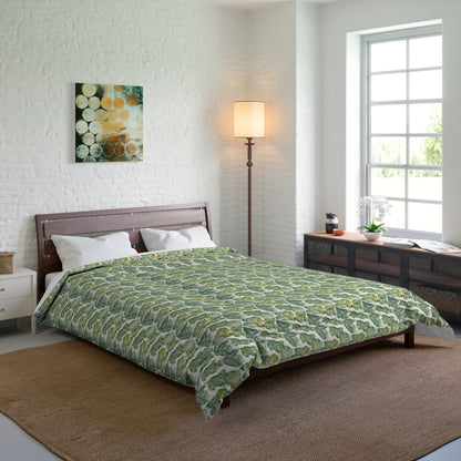 Bedroom with a green patterned comforter on a bed.