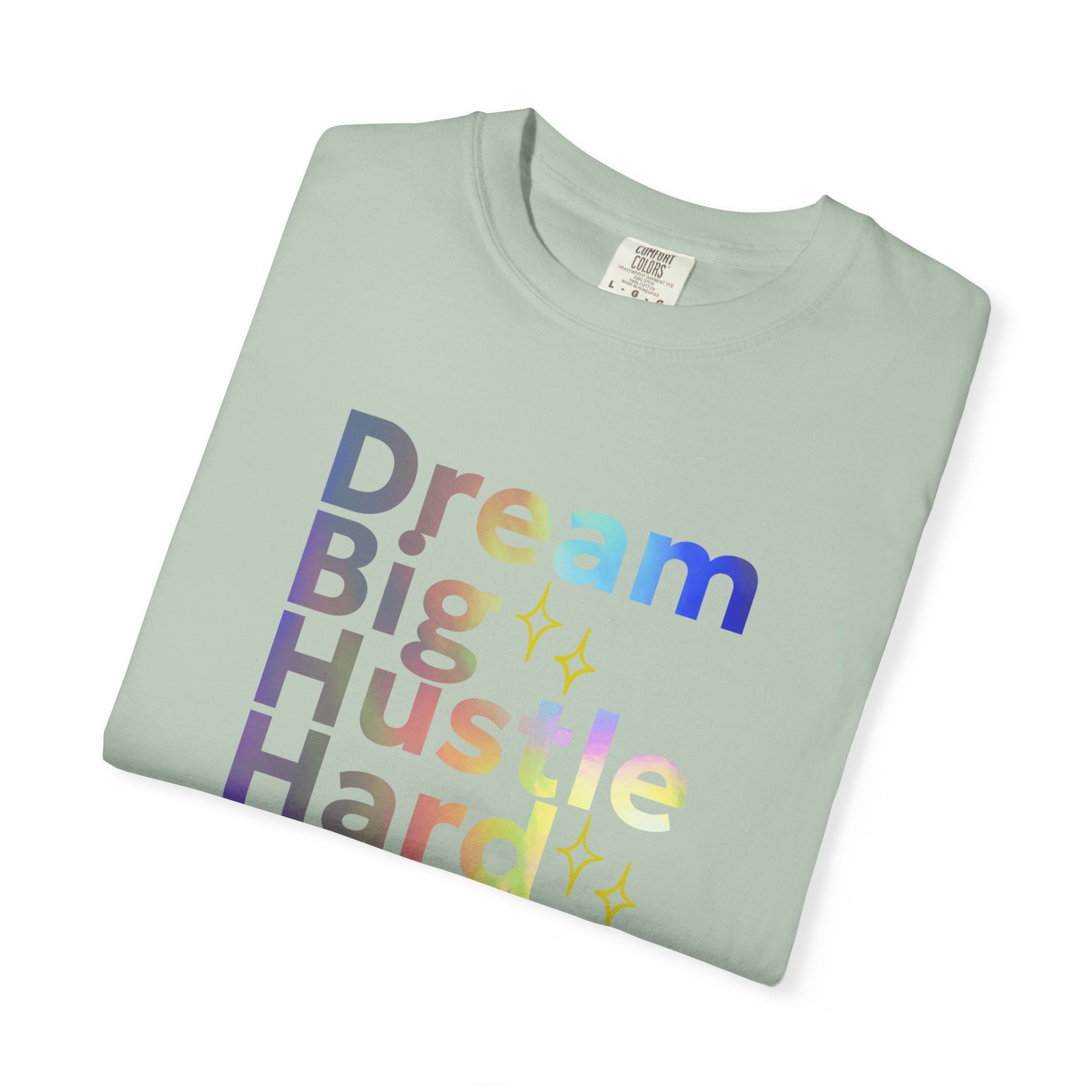 Folded light green t-shirt with colorful text on a white background