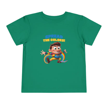 Cartoon boy jumping with rainbow trail and "Spread the Colors!" text on kelly T-shirt.

