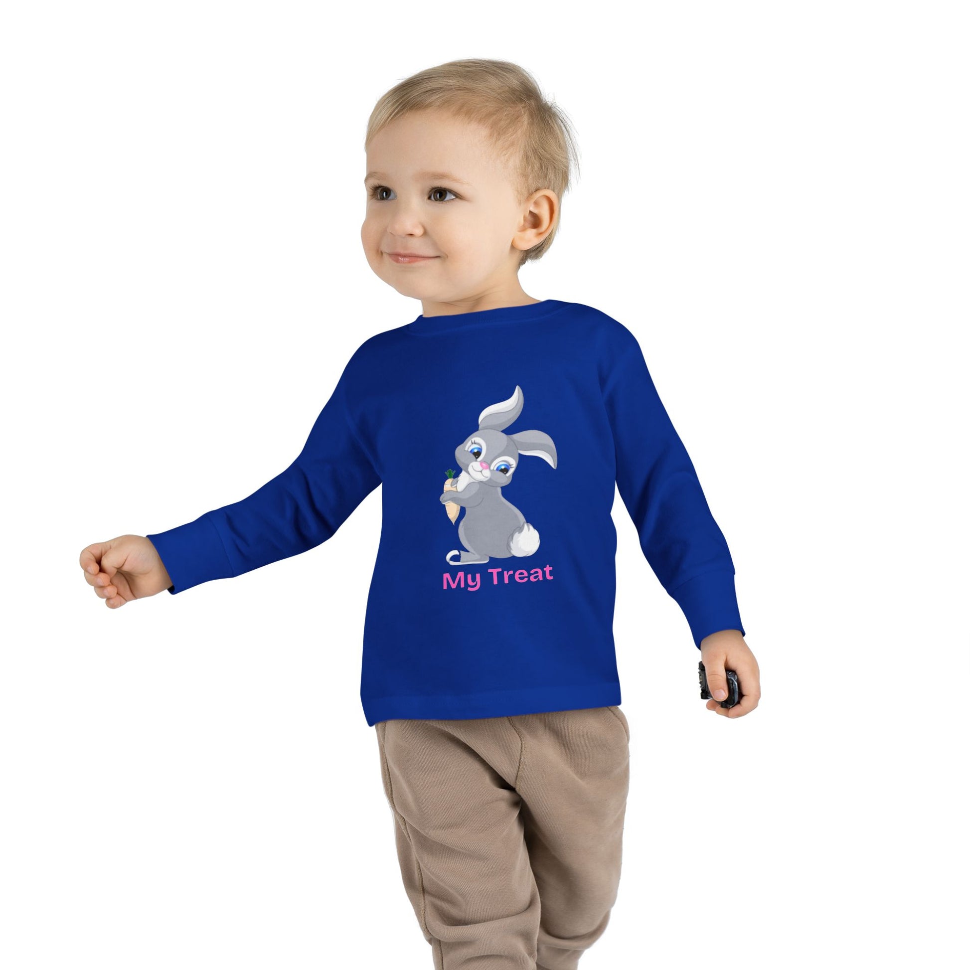 Child wearing a blue long-sleeve shirt with a cartoon character and text on a white background